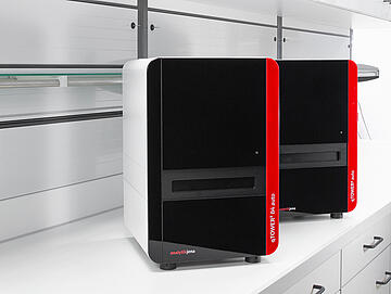 rendering of two qTOWER3 Auto units on a lab bench