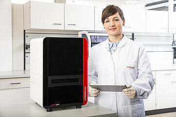 a person standing next to a qTOWER3 Auto