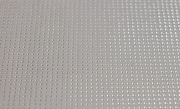 Close-up view of a MALDI target plate spotted with matrix via a CyBio Well Vario with 1536/8 microliter head.