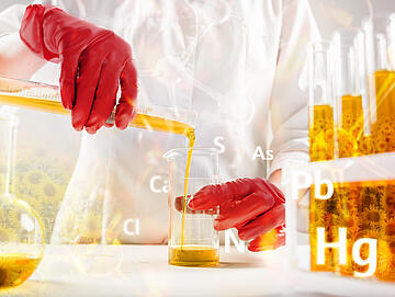 Scientist pouring organic oil. Beauty and cosmetics sciences. Laboratory equipment