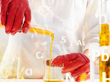 Scientist pouring organic oil. Beauty and cosmetics sciences. Laboratory equipment