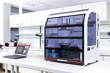 CyBio Felix on a lab bench, with laptop
