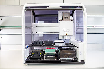 a CyBio Felix liquid handler showing the two-level pipetting deck and tip waste container